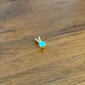 Opal pendant in gold setting.